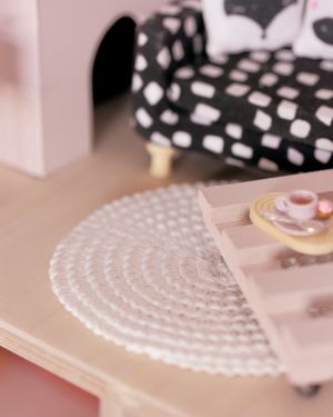 Round woven dollhouse carpet in white or natural